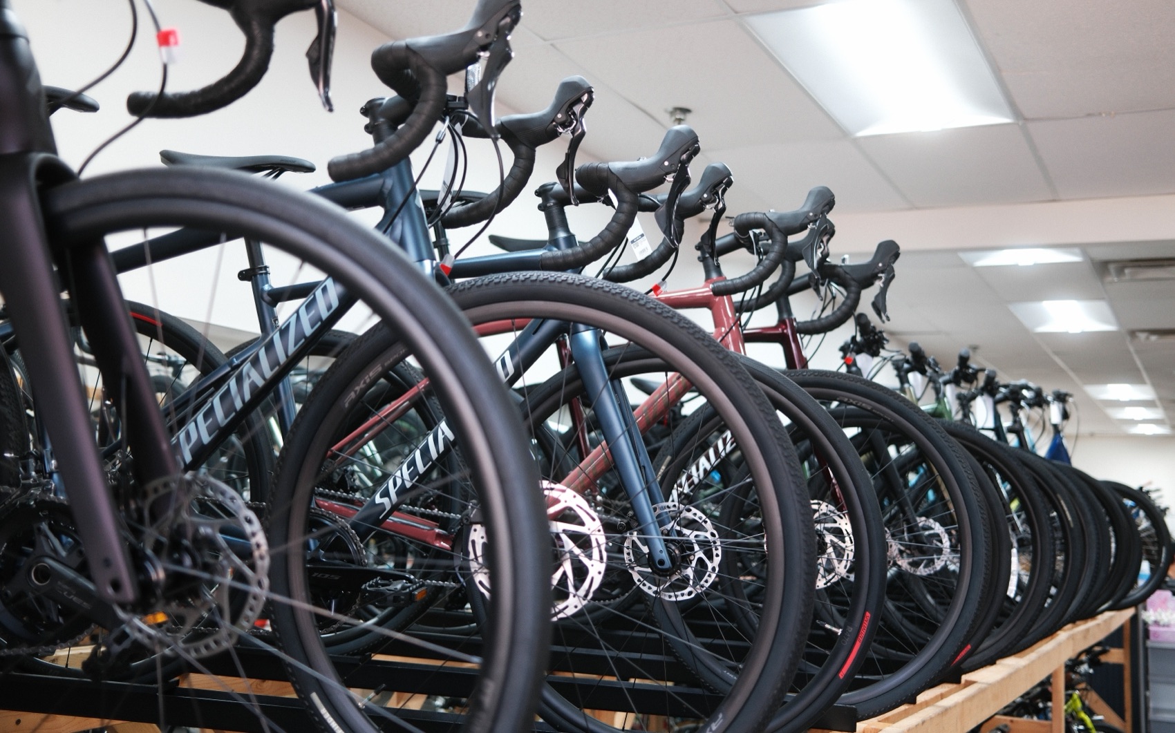 Row of Specialized bikes racked in the showroom at Oscar's Bike Shop