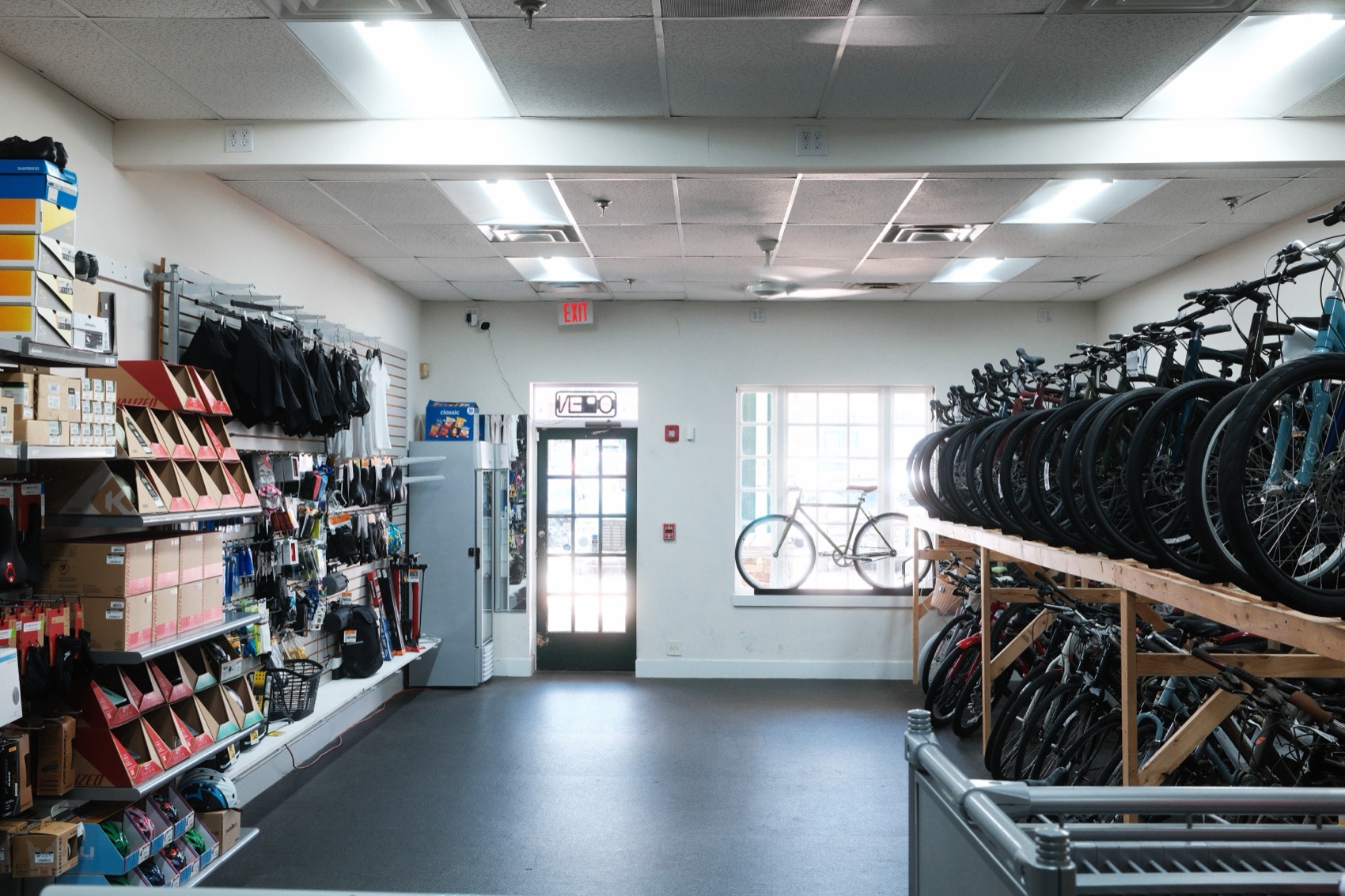 Wide view of the shop interior with bikes racked along the wall